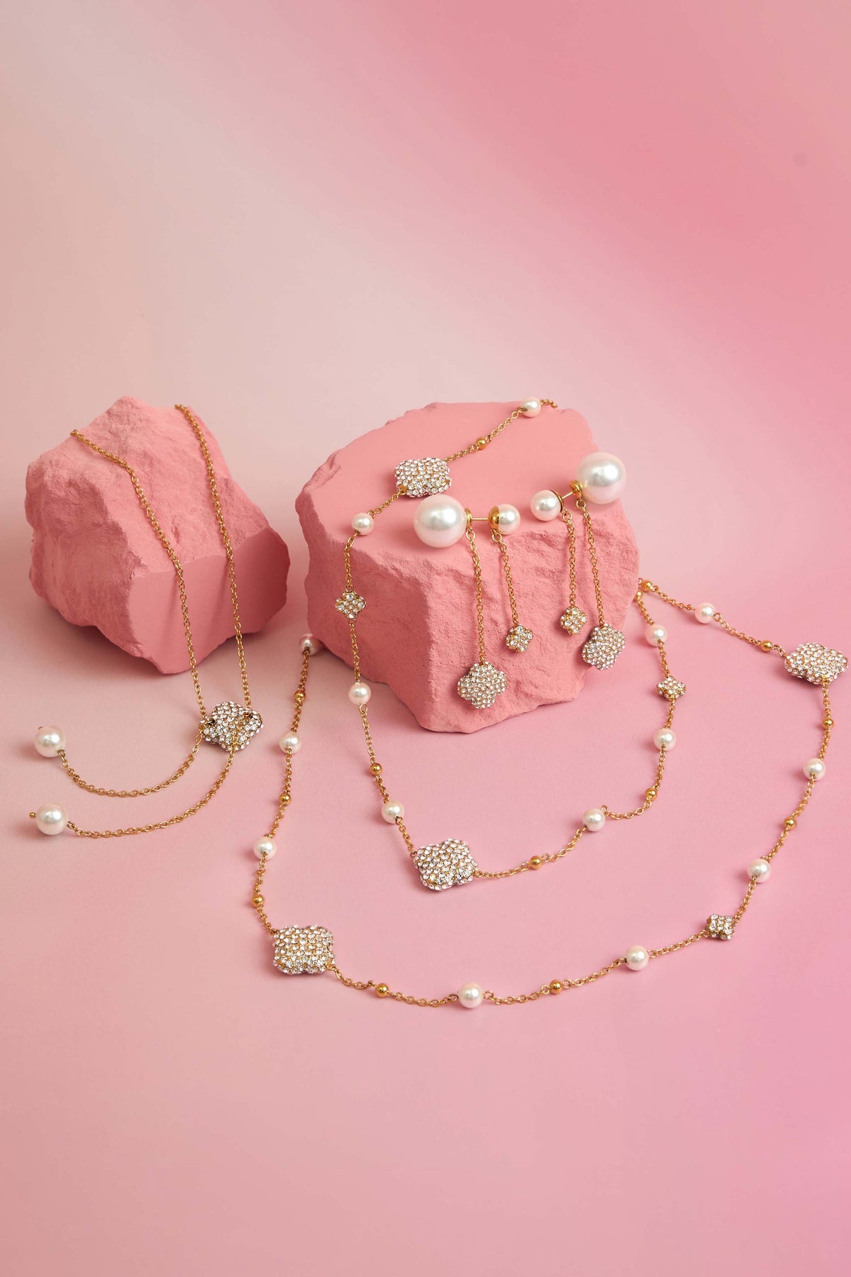 Rossi jewellery featuring the Carisma logo, displayed on pink blocks