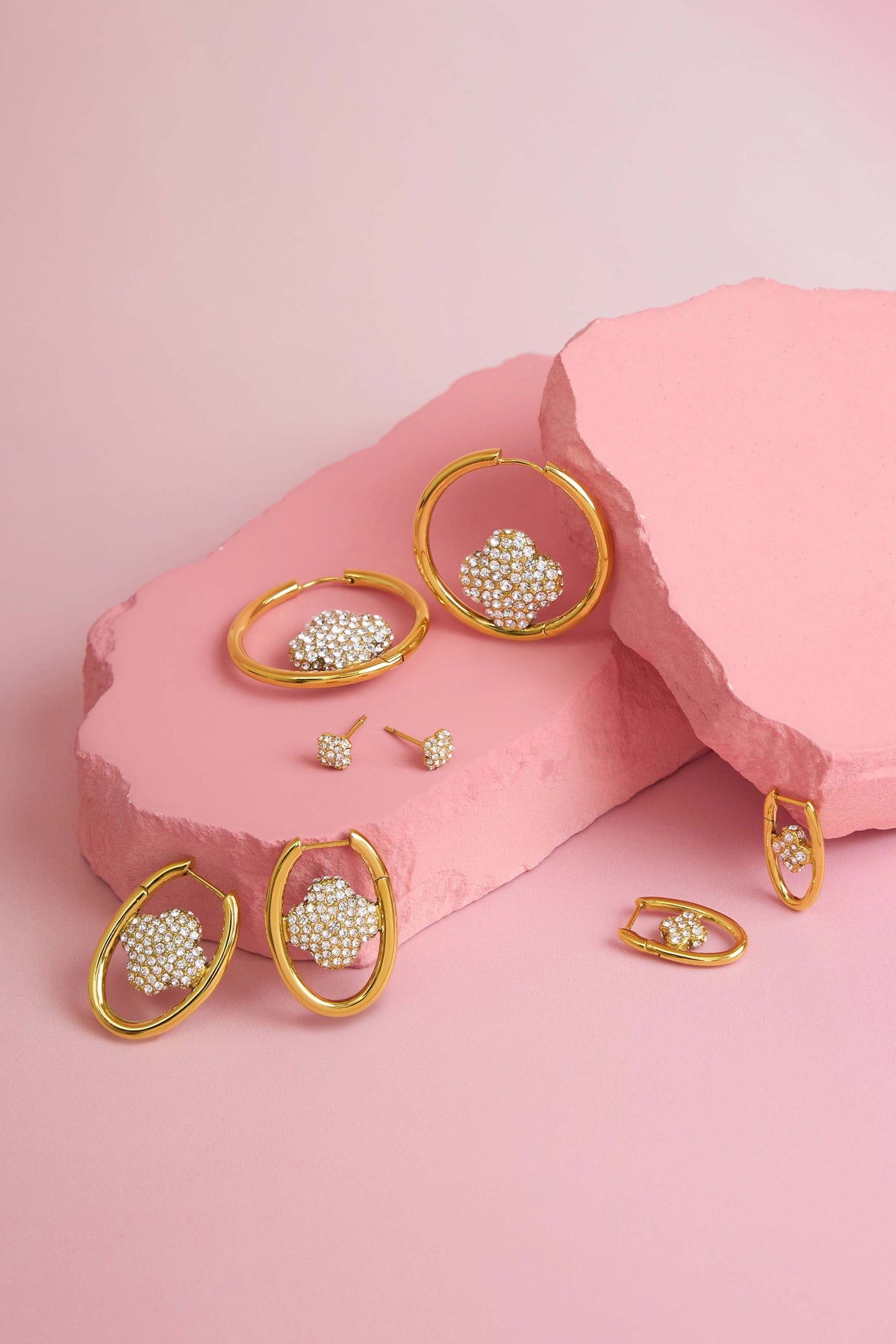 Rossi jewellery featuring the Carisma logo, displayed on pink blocks