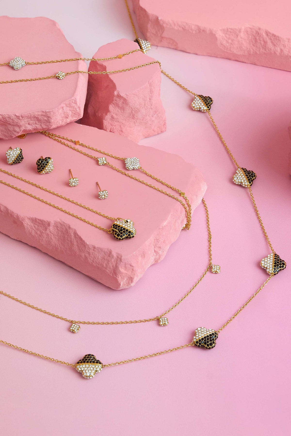 Rossi jewellery featuring the Carisma logo, displayed on pink blocks