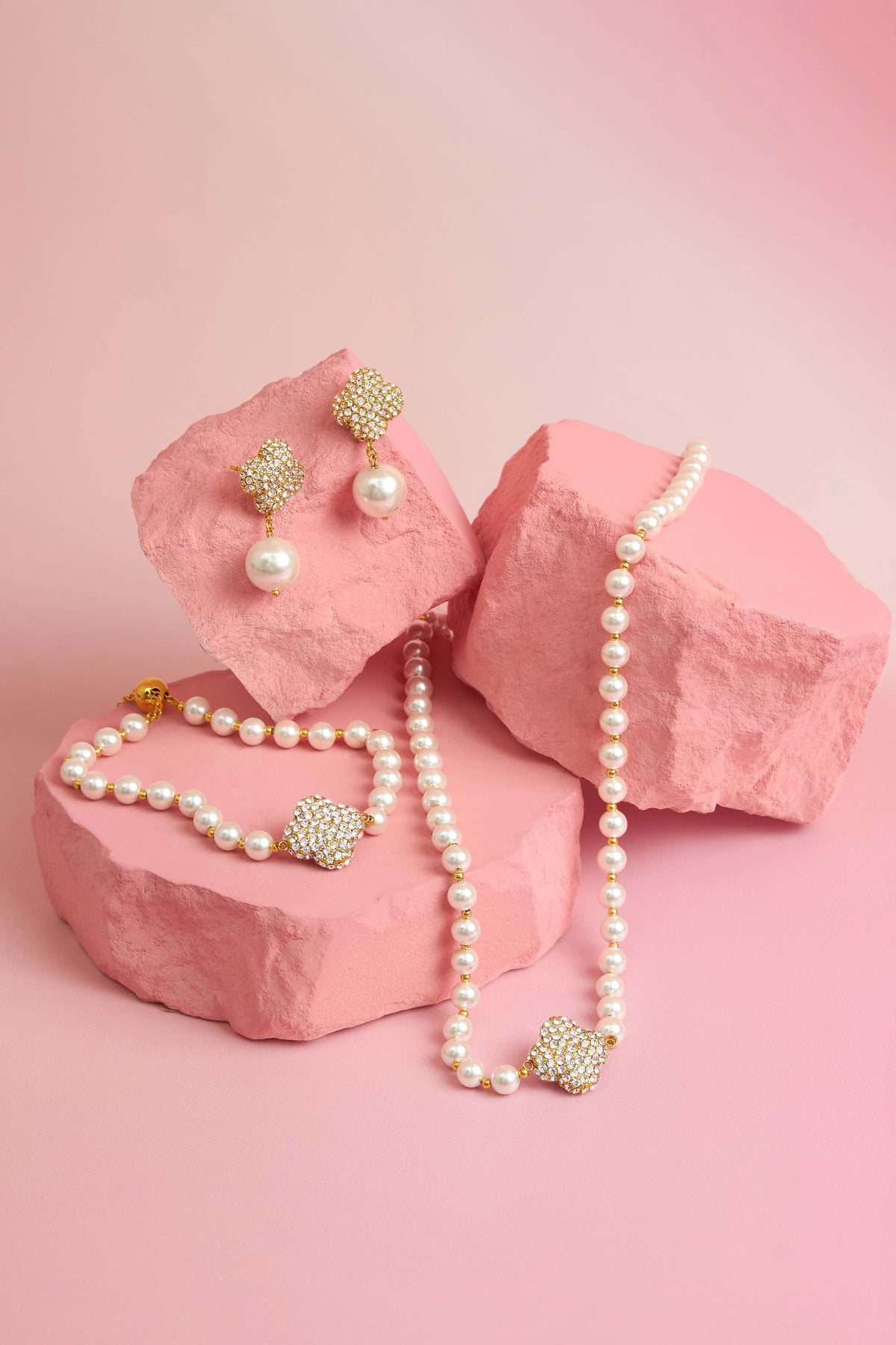 Rossi jewellery featuring the Carisma logo, displayed on pink blocks