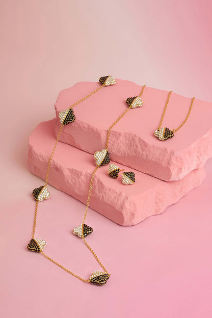 Rossi jewellery featuring the Carisma logo, displayed on pink blocks