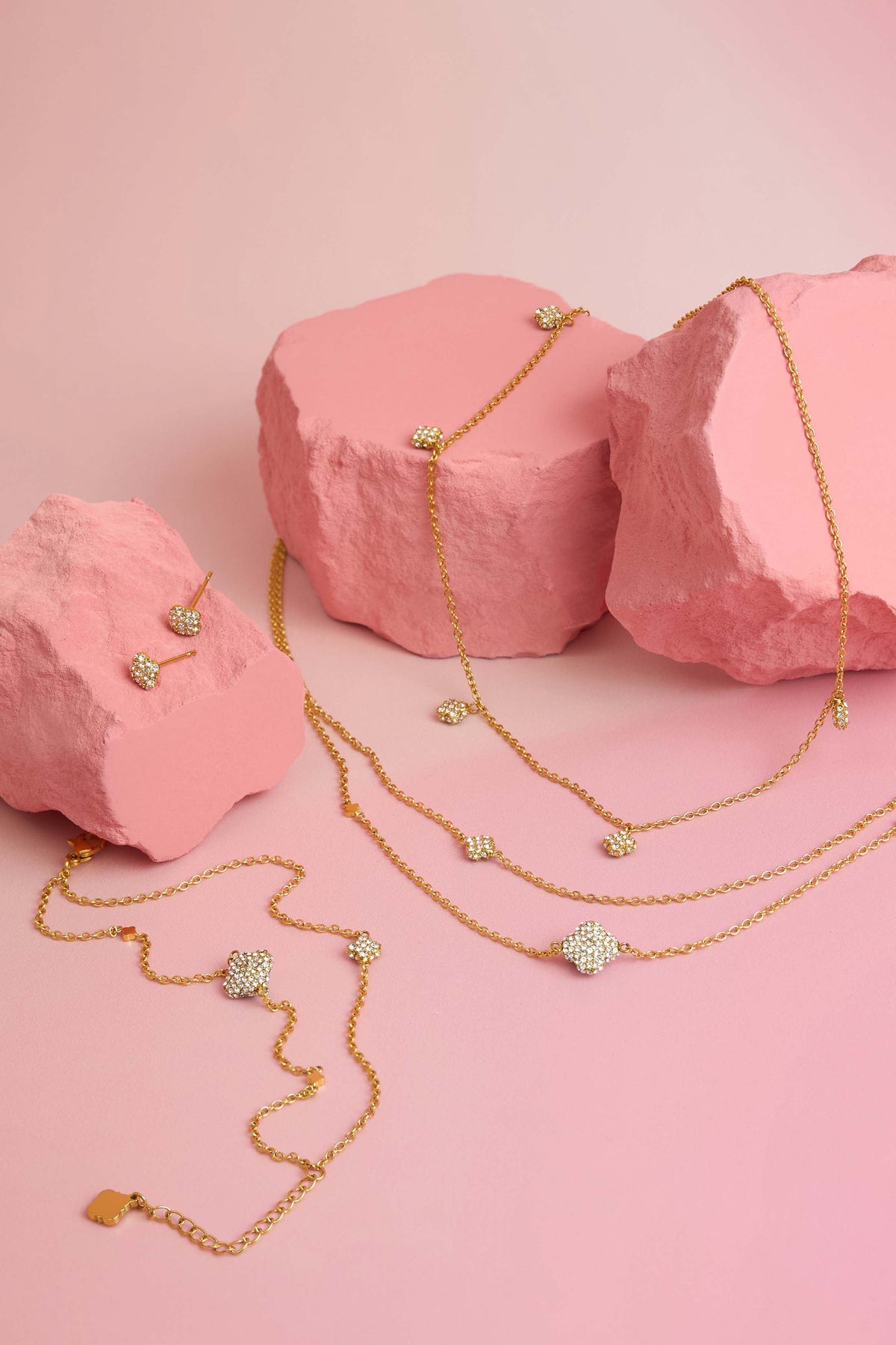 Rossi jewellery featuring the Carisma logo, displayed on pink blocks