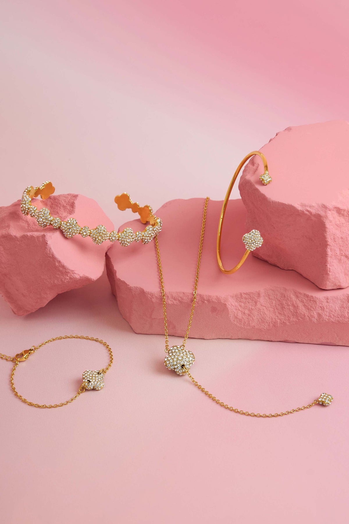 Rossi jewellery featuring the Carisma logo, displayed on pink blocks