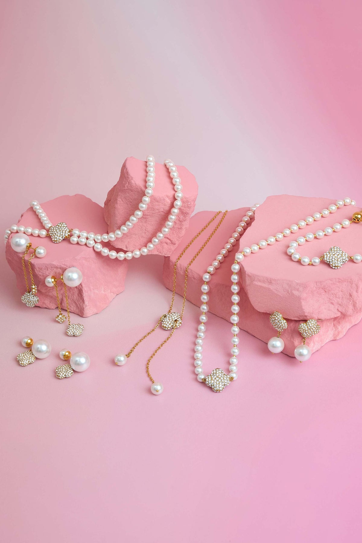 Rossi jewellery featuring the Carisma logo, displayed on pink blocks