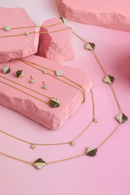 Rossi jewellery featuring the Carisma logo, displayed on pink blocks