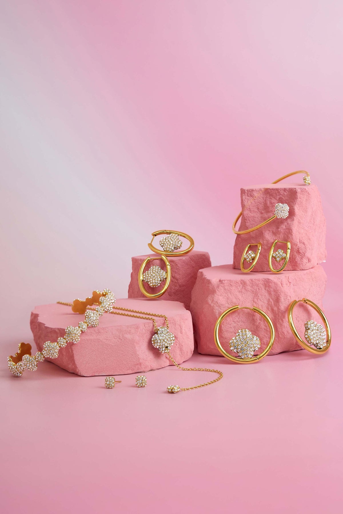 Rossi jewellery featuring the Carisma logo, displayed on pink blocks