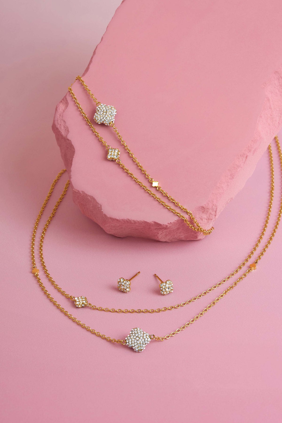 Rossi jewellery featuring the Carisma logo, displayed on pink blocks