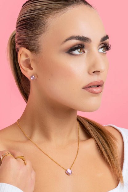 Model wearing April Logo Birthstone Stud Earring Set