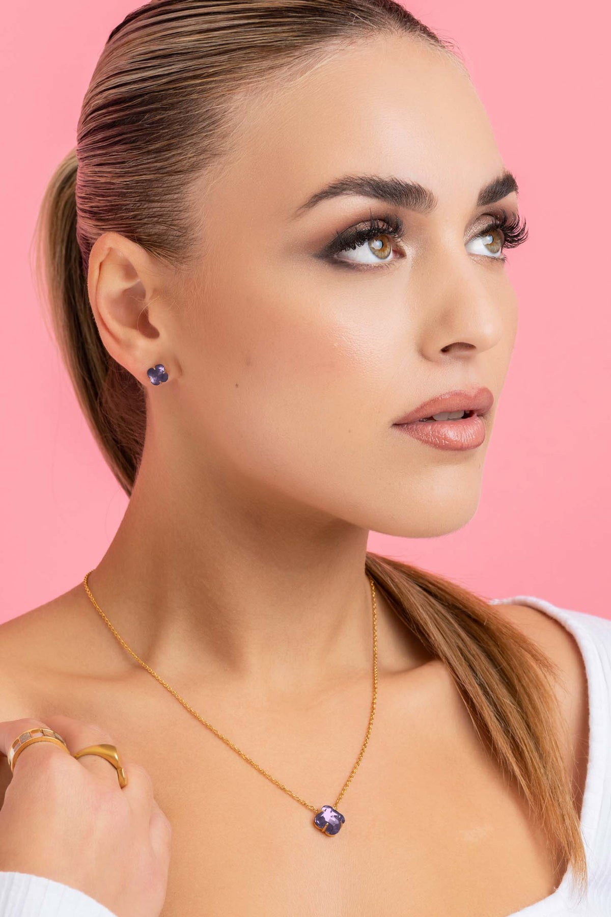 Model wearing October Logo Birthstone Stud Earring Set